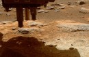 This image shows the Martian surface below the Perseverance rover