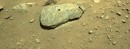 The drill hole made by Perseverence into the surface of a Martian rock named "Rochette"