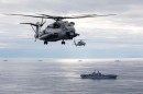 USS Iwo Jima with A CH-53E Super Stallion helicopter and an MH-60S Sea Hawk helicopter