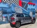 Trav MSK’s Corolla Cross and mural in Los Angeles