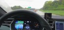 Tesla Model S driving on highway with Autopilot and 8.0 software