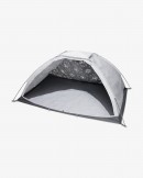 The Nike Metamorph Poncho turns into a camping tent or a sunshade, "adapting" to the environment