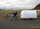 The Nomad is a bicycle camper made from discarded campaign billboards, lightweight and stable
