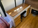 Off-grid Skoolie includes a small workspace that hides away an electric piano