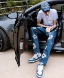 NBA player Chet Holmgren poses with an Audi RS 7