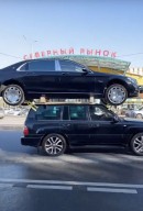 Toyota Land Cruiser carries a Mercedes-Maybach S-Class on its roof