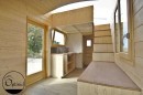 The Marie-Ange tiny house from Optinid is very rustic-looking, has trademark sliding roof