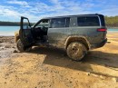 Owner abandons Rivian R1S on the lake shore after getting stuck in the frozen mud
