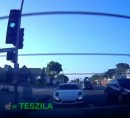 Porsche Cayman spins as it chases Model S