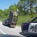 Porsche driver tows jacuzzi on home-made wooden trailer on the highway