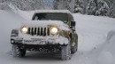 Jeep Wrangler driving on snow