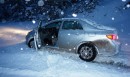 Toyota Corolla sedan stuck in snow