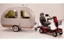 The QTvan can be towed by mobility scooter or bike, was named smallest trailer in the world in 2015