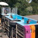 Old Tadao public transit bus converted into a functional public pool