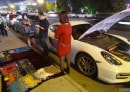 Rich Kid Porsche Cayman Owner Sells Scarves on the Sidewalk to Get Gas-Money
