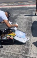 Rick Ross Changing Outside Private Jet