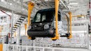 Rivian's manufacturing plant in Normal, IL employs multi-level automated conveyance systems to transfer vehicles and components between stations