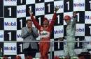 Rubens Barrichello ethusiastic after his win in the 2000 German Grand Prix, on the podium, alongside Mika Hakkinen