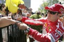 Rubens Barrichello signs autographs during the 2005 Australian GP