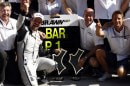 Rubens Barrichello celebrates his maiden Brawn GP win with his team, in Valencia