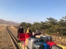 Russian diplomats ride hand-pushed trolley back home from North Korea