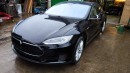 Russian Mechanic Proves Fixing a Tesla Wreck Is Not Impossible