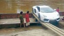 Lamborghini Aventador crosses river on a boat