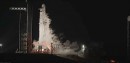 Falcon Heavy launch and booster landing at night
