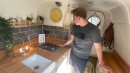 Self-Built Camper Van Is a Unique Apartment on Wheels With an Epic Garage and a Hidden TV