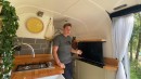 Self-Built Camper Van Is a Unique Apartment on Wheels With an Epic Garage and a Hidden TV
