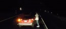 Drunk guy urinating in the middle of the highway