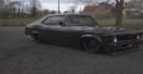 Slammed all-black Chevrolet Nova SS with red calipers and purple interior by personalizatuauto on Instagram