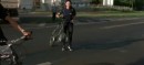 Bicycle rider "jaywalks" on live TV and tempts fate twice
