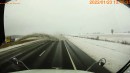 View from a truck as snow plow sends ice, snow, and dirt into oncoming traffic on the opposite lane