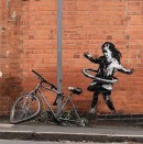 Hula-hooping girl by Banksy in Nottingham, England