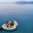 Spacruzzi is a hot tub boat with a fireplace stove and claims of being the greenest floating hot tub ever
