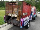 Tiger King replica van comes with animal trailer and stuffed toy tiger in the back