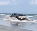 The Tesla Cybertruck drives through water at the Gulf of Mexico