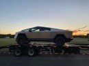 Tesla Cybertruck pickups on a back of a trailer