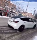 Tesla Model Y pulls semi stuck in snow