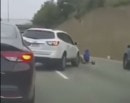 Man rides pedal trike on highway