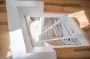 The 2-Story Cabin offers a most interesting layout, uses glazing and mirrors to trick you