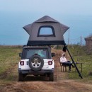 The Air Cruiser rooftop tent by Cinch and Wild Land is self-assembling, ultra-light, durable, four-season, and spacious