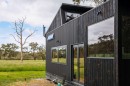 The Cocoon Tiny House Comes with a Dark Exterior and Bright Interior