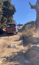 Rivian R1T goes uphill on off-road course