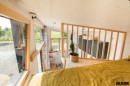 The ia Orana tiny house makes up for its compact footprint with plenty of glazing and smart design