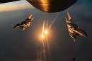F-15 Strike Eagles after aerial refueling, set off flares