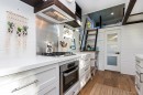 The Millennial tiny house has huge kitchen, permanent rooftop patio, and elegant finishes