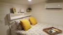 The Phoenix is a custom gooseneck tiny house with luxury features and a very cozy interior