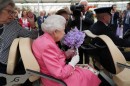 Queen Elizabeth II makes surprise appearance in electric luxury golf buggy dubbed the Queen Mobile